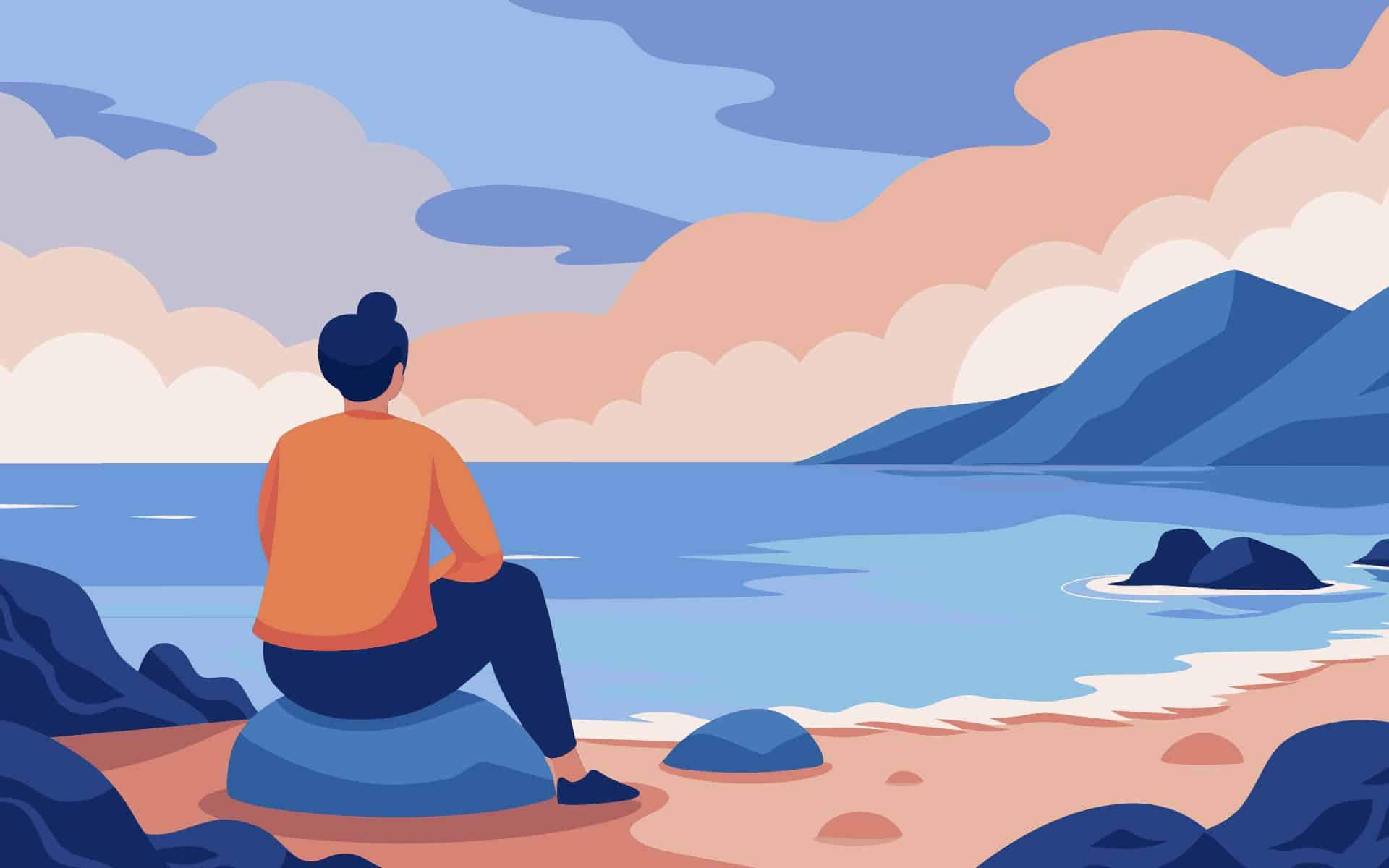 Sitting on a rocky beach watching the waves crash against the shore and feeling a sense of peace..