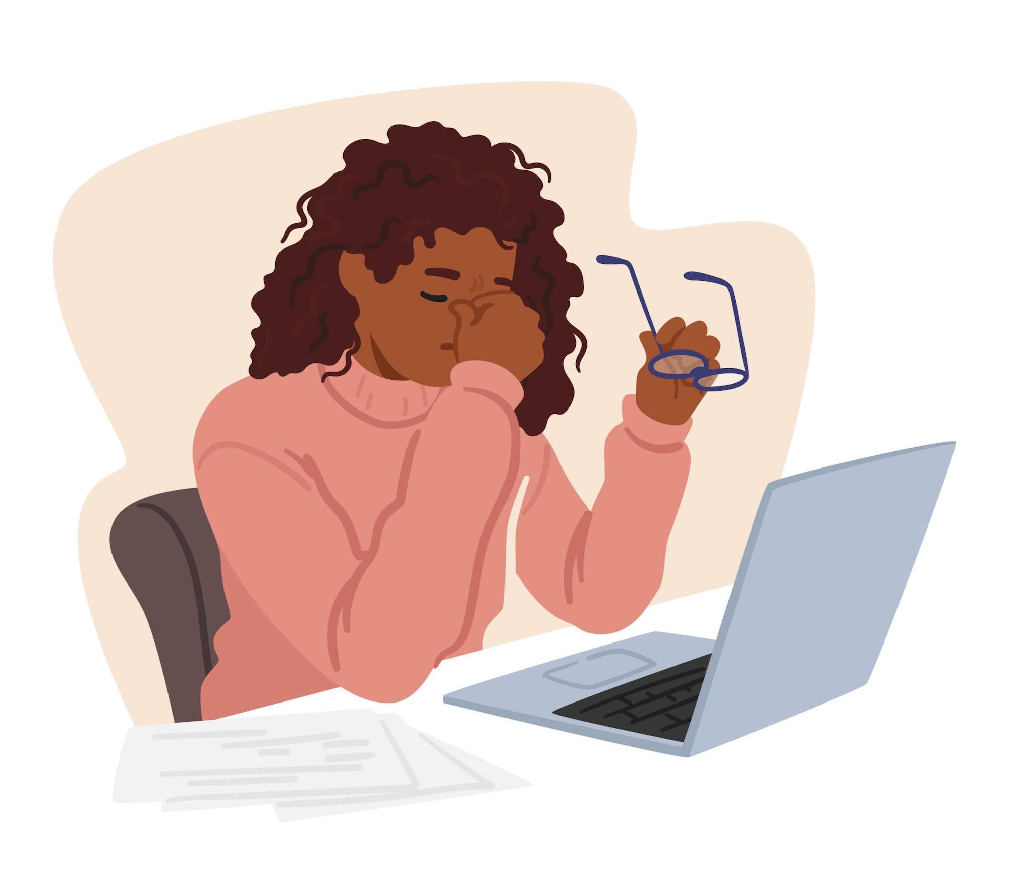 Woman at computer rubbing her eyes