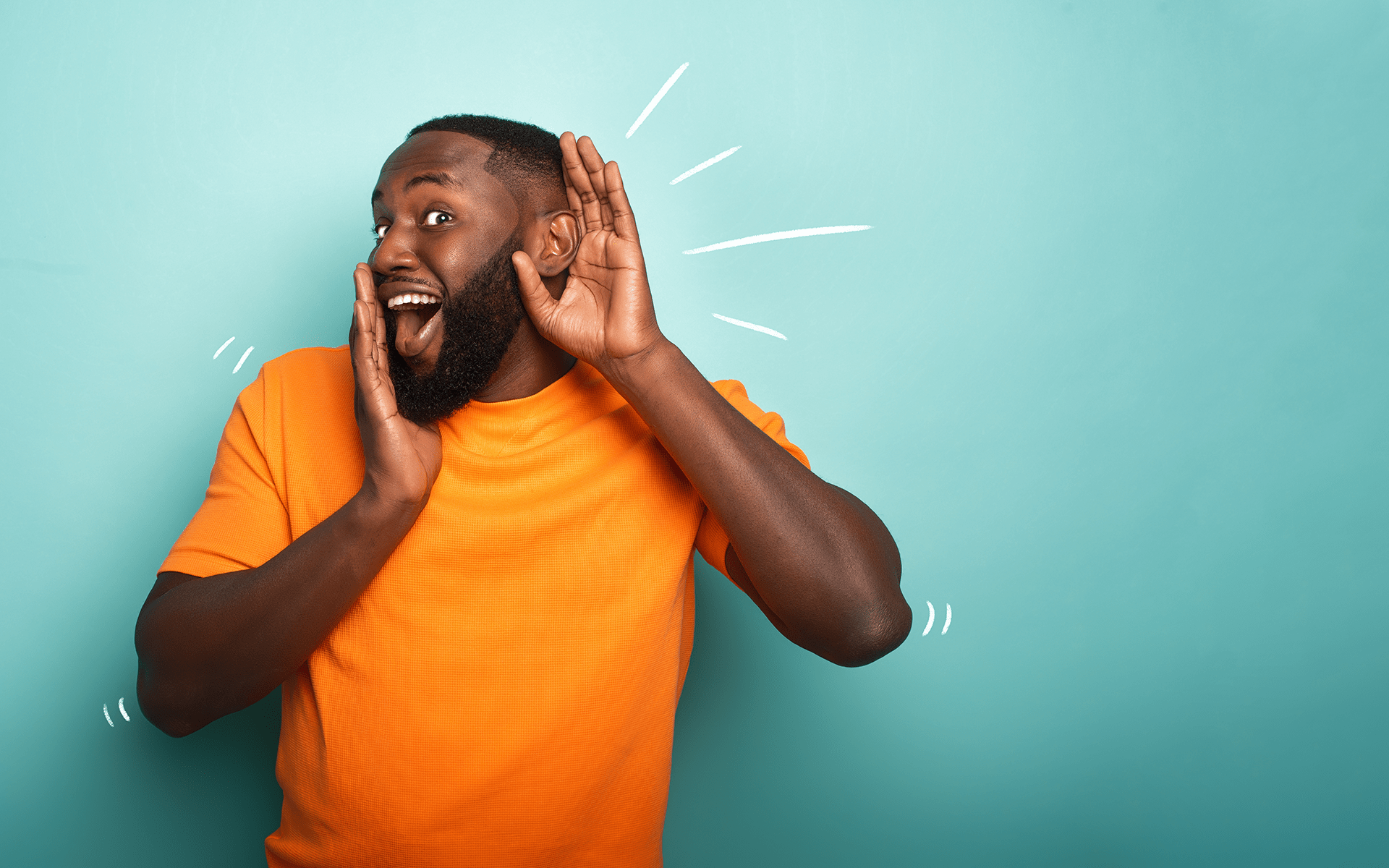 How Do You Spark Your Sense of Wonder?—A Black man wearing an orange shirt holds one hand up to his mouth and one up to his ear with a curious expression on his face in front of a light blue studio background.