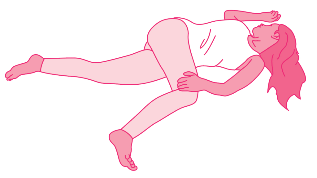 A person lying down in a pink outfit with long hair.
